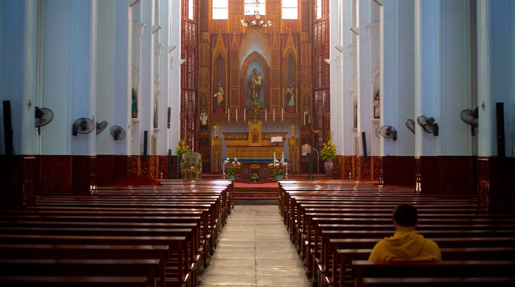 St. Joseph Cathedral featuring a church or cathedral, religious aspects and interior views