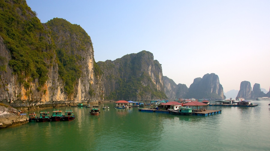 Halong Bay featuring a coastal town, rugged coastline and a gorge or canyon