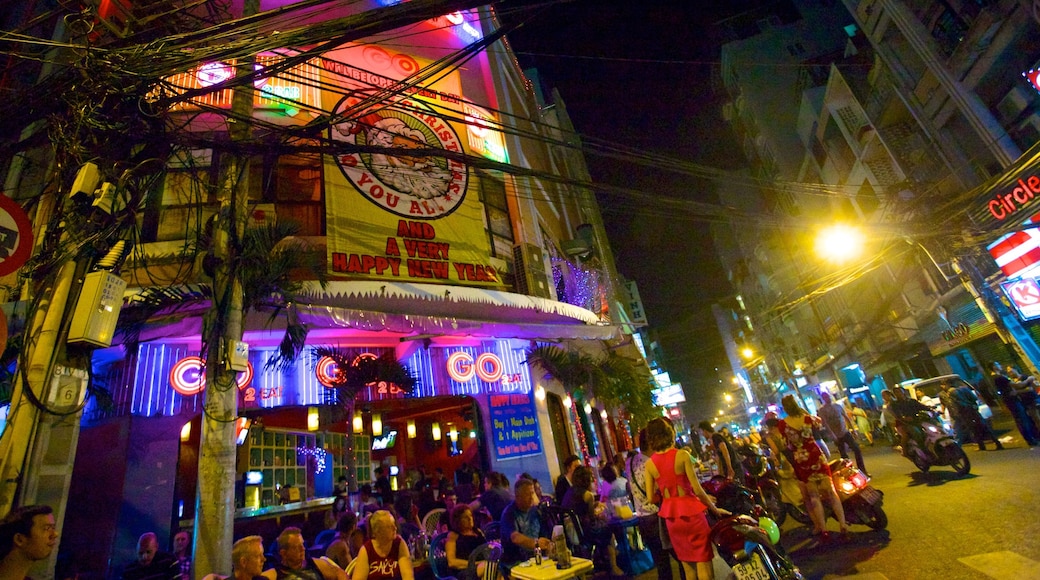 Pham Ngu Lao Street showing signage, a city and a bar