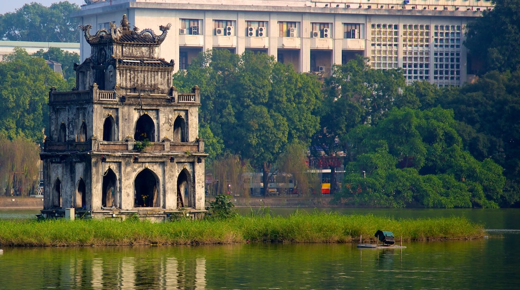 Hoan Kiem Lake featuring a lake or waterhole, a monument and heritage architecture