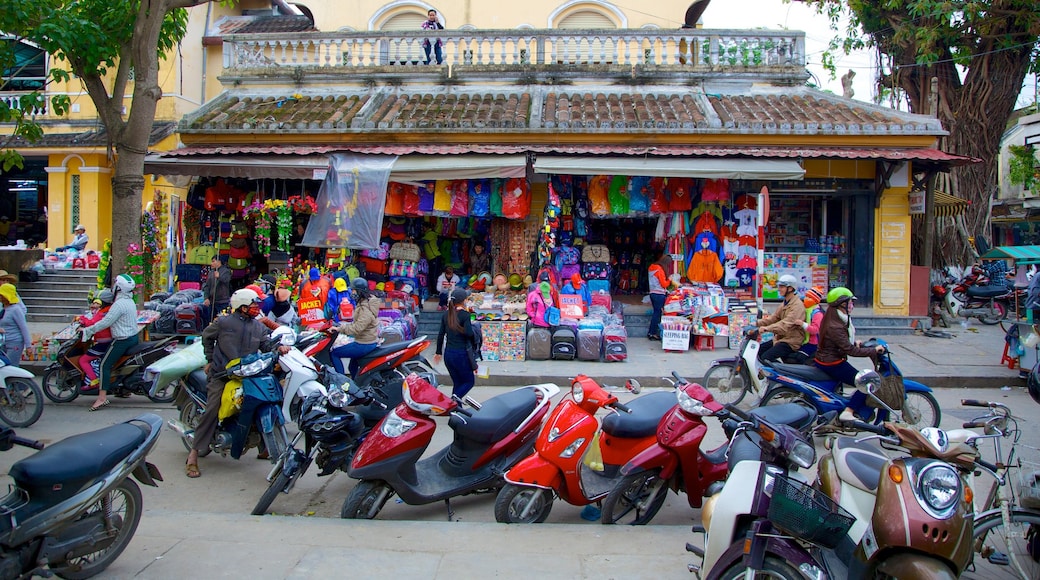 Hoi An City Centre featuring motorcycle riding, markets and street scenes