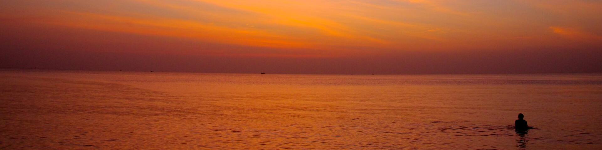 Phu Quoc Beach which includes general coastal views, a sunset and landscape views