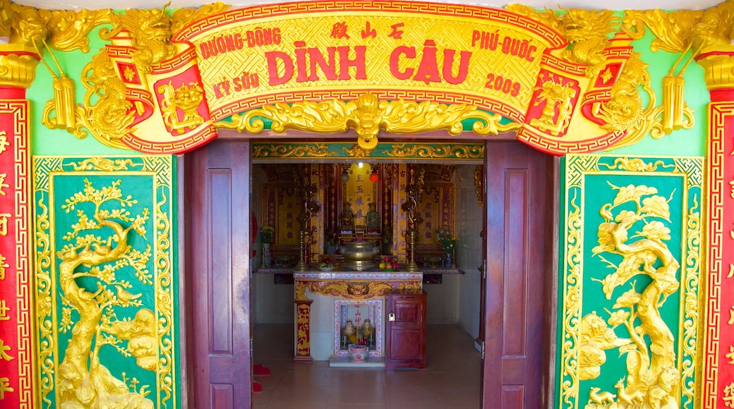 Dinh Cau Temple which includes a temple or place of worship, signage and religious elements