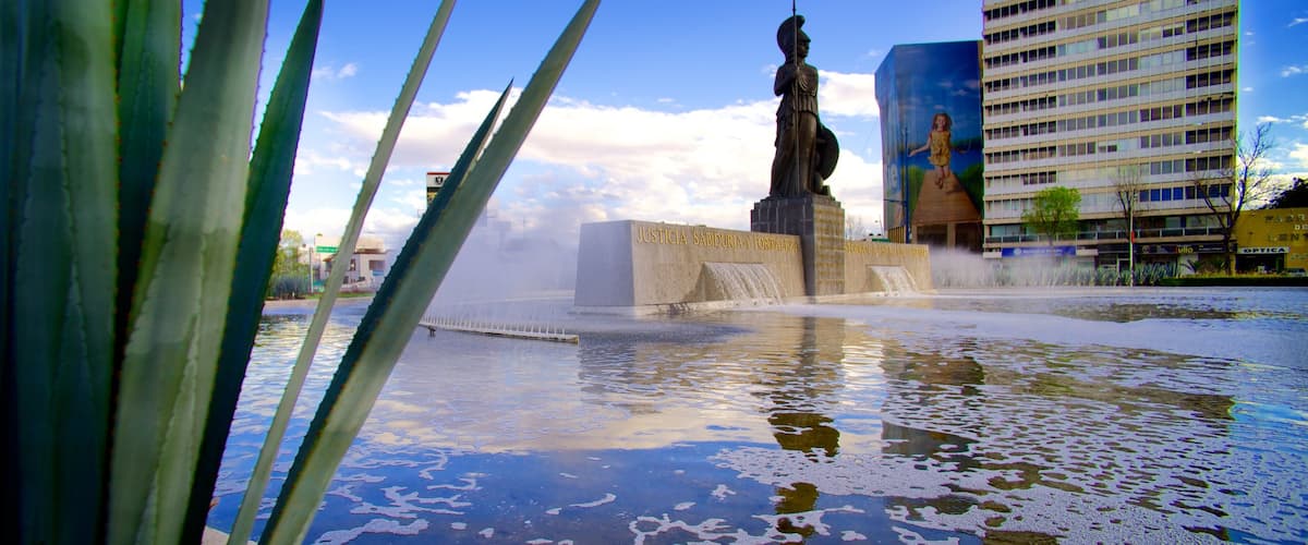 La Minerva featuring a hotel, a statue or sculpture and a pond