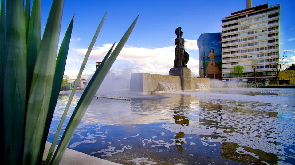 La Minerva showing a hotel, a statue or sculpture and a pond