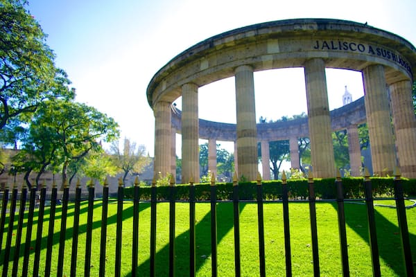 Rotonda de los Hombres Ilustres showing a garden, a memorial and heritage architecture