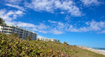 Jupiter showing a beach, a luxury hotel or resort and general coastal views