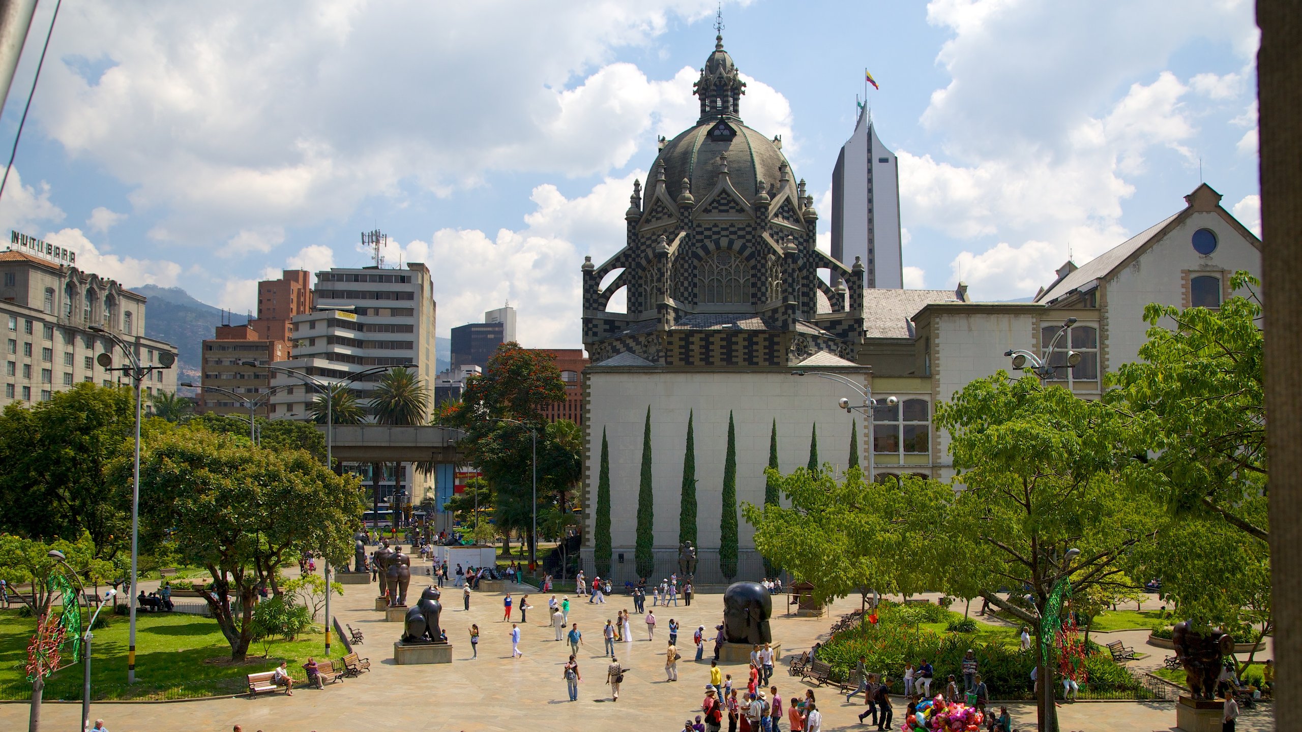 Botero Square Sculpture Park which includes a church or cathedral, a city and a square or plaza