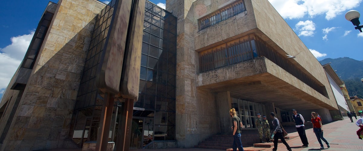 Luis Angel Arango Library featuring modern architecture and an administrative buidling as well as a small group of people
