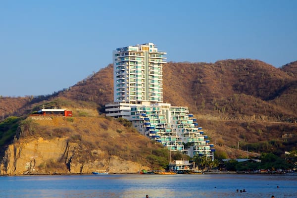 Rodadero Beach featuring a luxury hotel or resort, general coastal views and rocky coastline