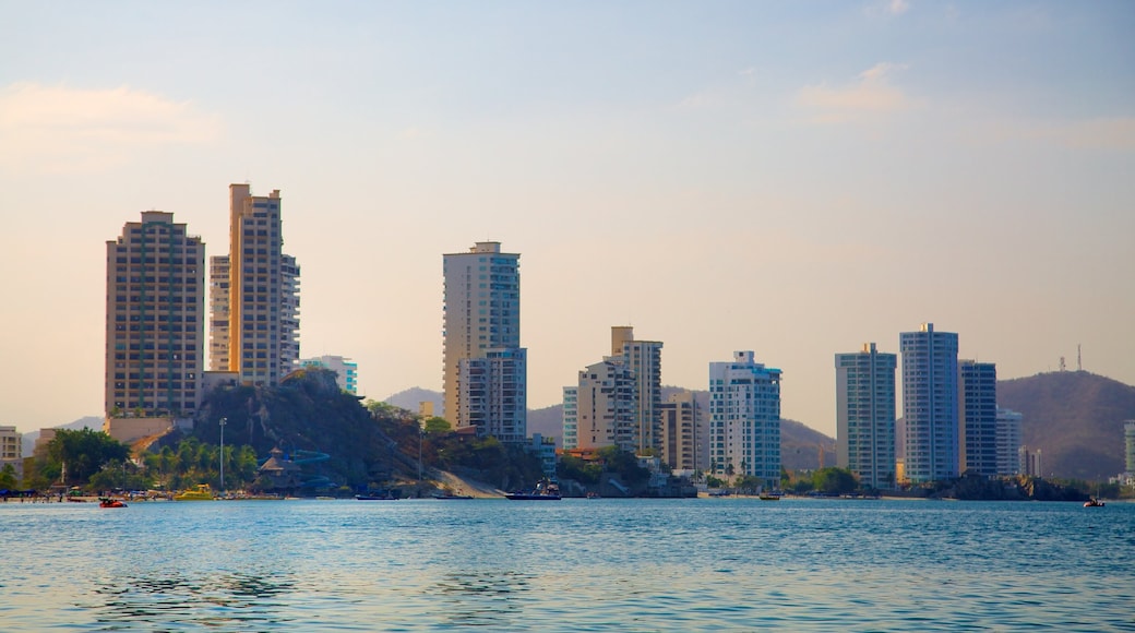 Rodadero Beach showing general coastal views, a skyscraper and a coastal town