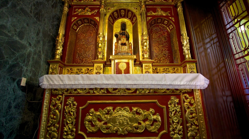 Monserrate which includes a church or cathedral, interior views and religious aspects