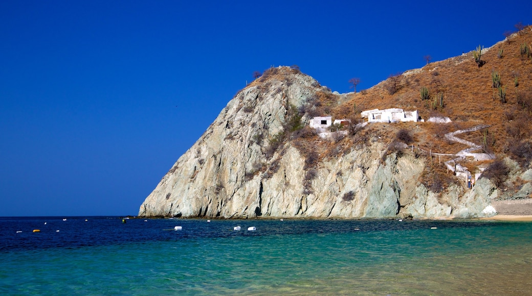 Blanca Beach showing mountains, rugged coastline and general coastal views