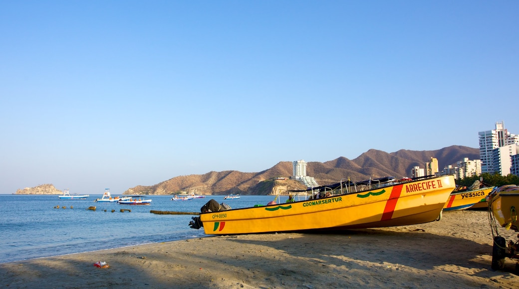 Rodadero Beach featuring a coastal town, a sandy beach and boating