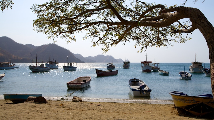 Taganga Beach featuring boating, a sandy beach and a bay or harbor