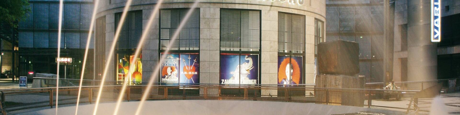 Friedrichsbau Vaudeville Theater showing a square or plaza, signage and theatre scenes