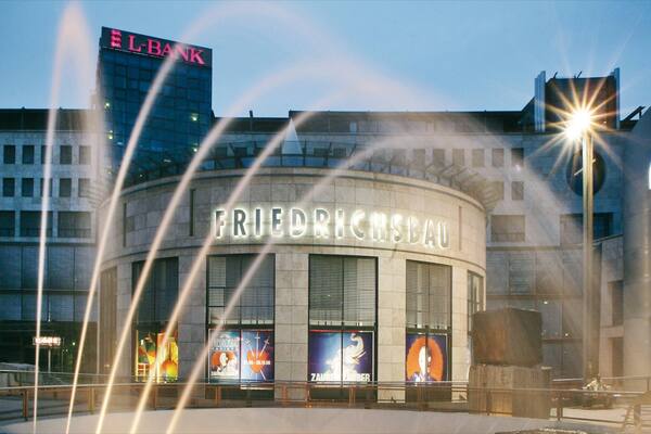 Friedrichsbau Vaudeville Theater showing a square or plaza, signage and theatre scenes