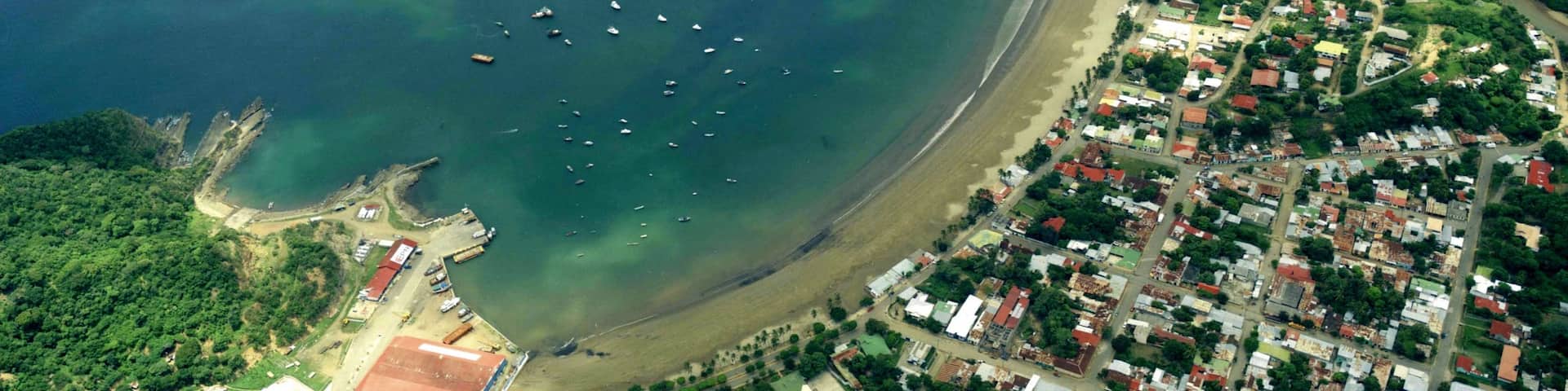 San Juan del Sur featuring a coastal town, a bay or harbour and a sandy beach