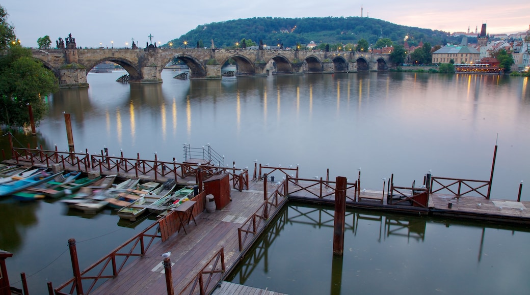 Prague Castle showing a marina, a bridge and a river or creek