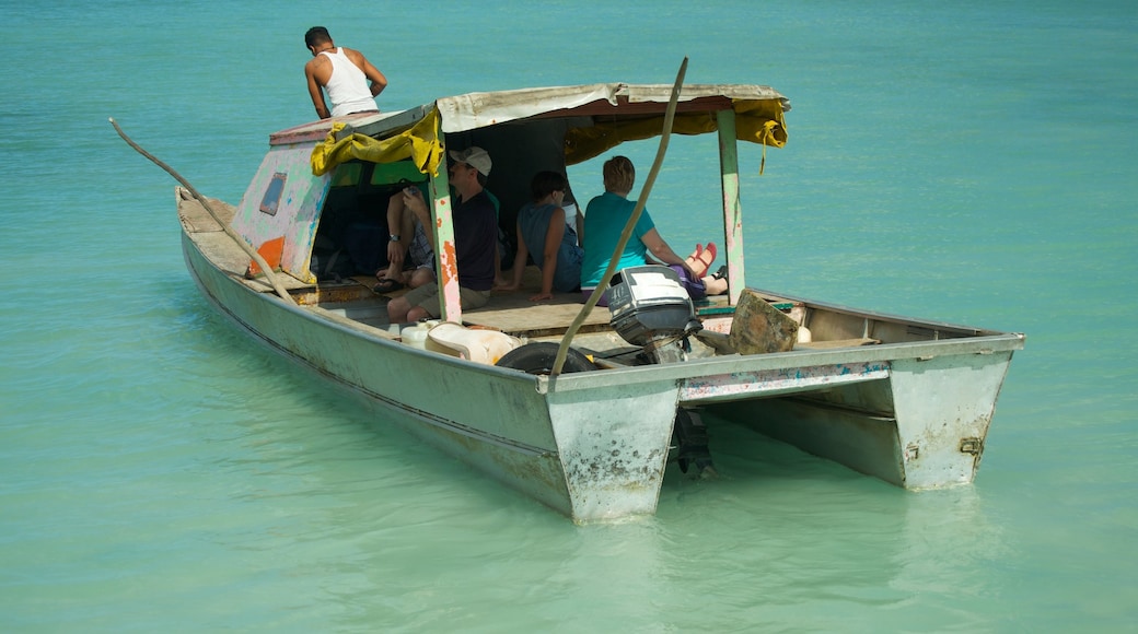 Manono showing boating and tropical scenes as well as a small group of people