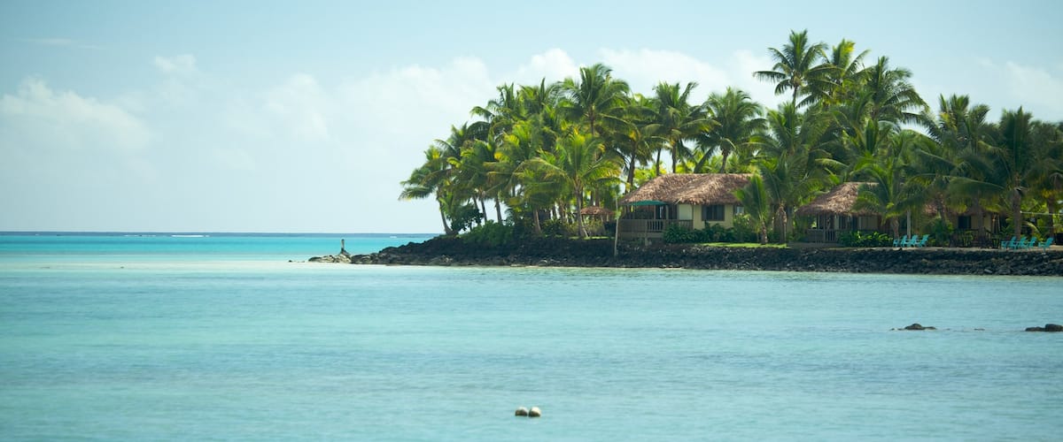 Manono featuring a house, rocky coastline and tropical scenes