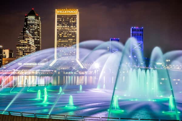 Friendship Park which includes skyline, a fountain and night scenes