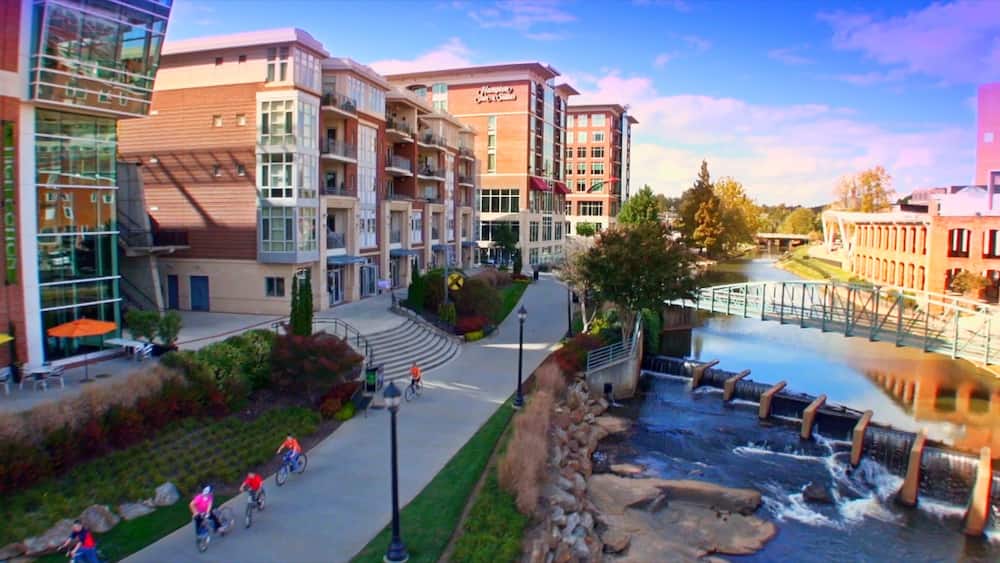 Greenville which includes a bridge, a river or creek and a city