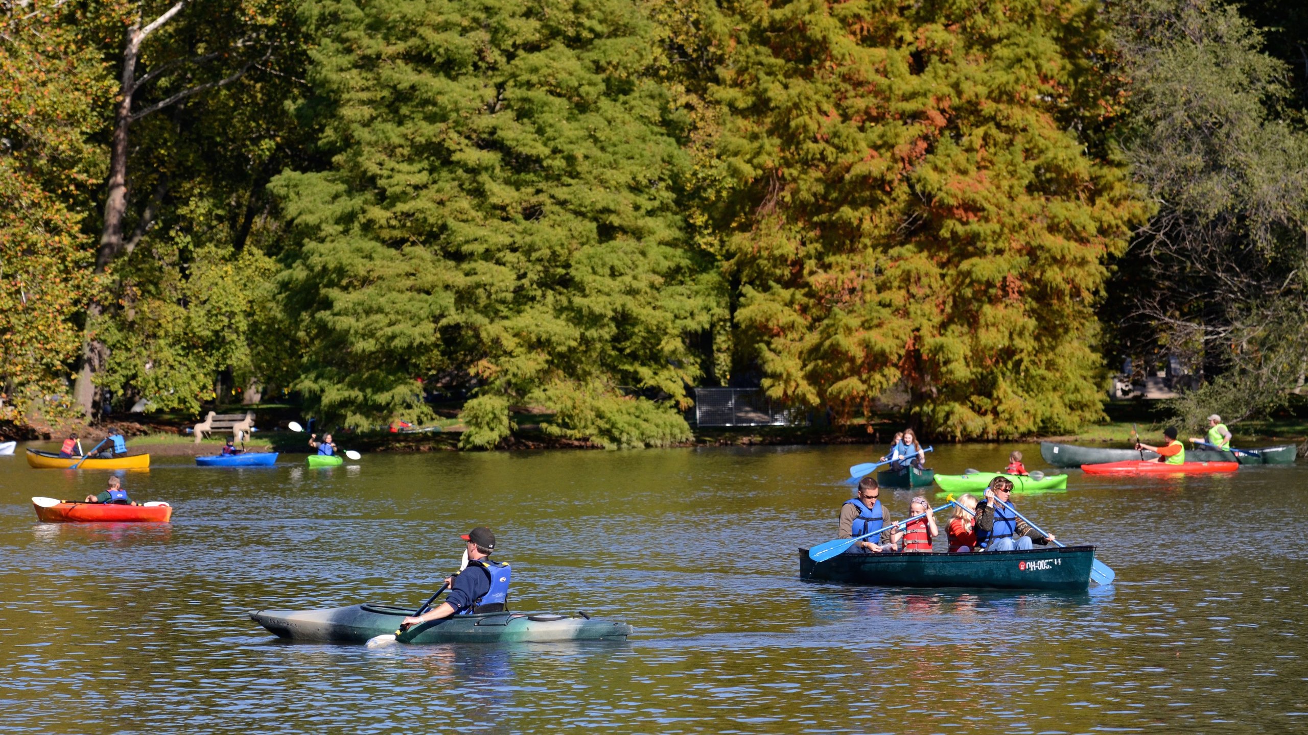 Dayton showing kayaking or canoeing and a lake or waterhole as well as a small group of people