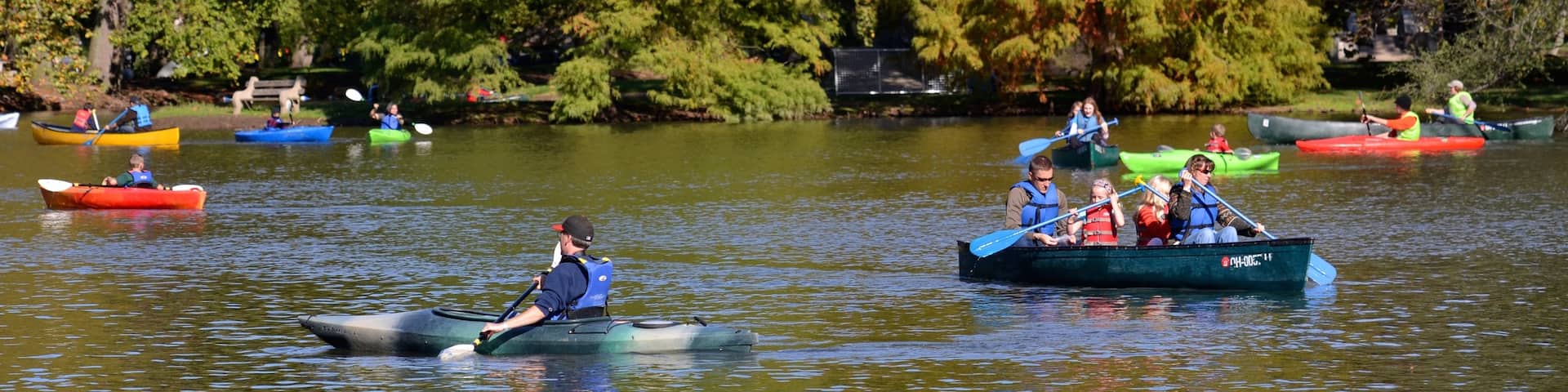 Dayton showing kayaking or canoeing and a lake or waterhole as well as a small group of people