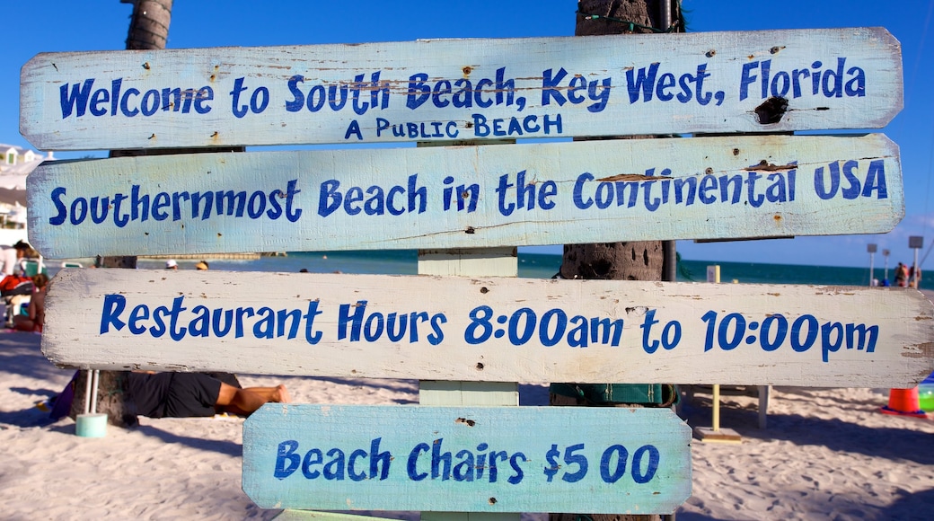 South Beach which includes signage and a sandy beach