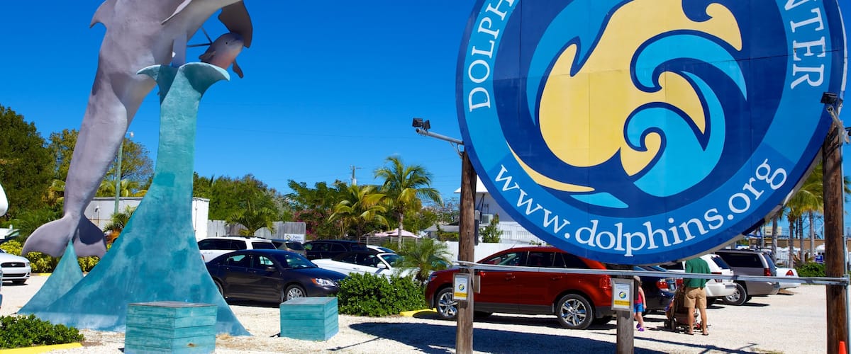 Dolphin Research Center showing a statue or sculpture and signage