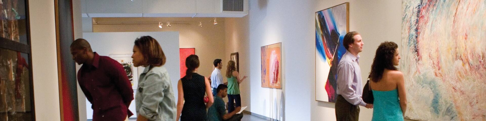 Jacksonville Museum of Modern Art featuring art as well as a small group of people