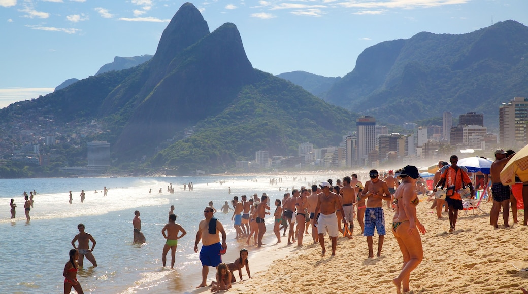 Ipanema Beach which includes a beach and mountains as well as a large group of people