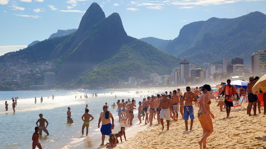 Ipanema Beach which includes a beach and mountains as well as a large group of people