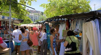 Ipanema featuring markets as well as a large group of people