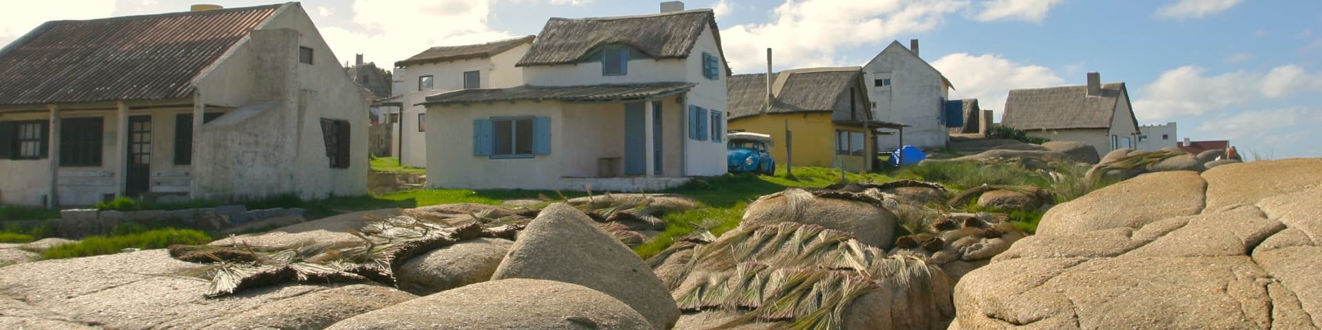Punta del Diablo featuring a house and a small town or village