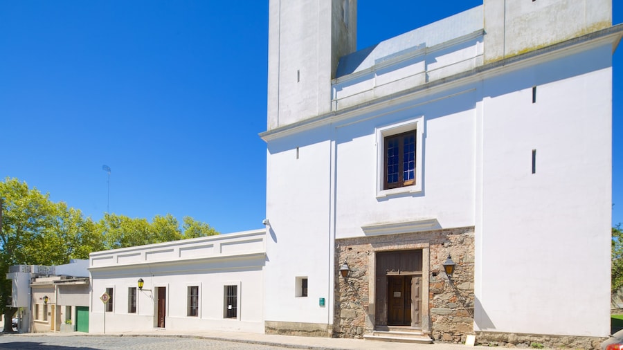 Matriz Church which includes heritage architecture, street scenes and a small town or village