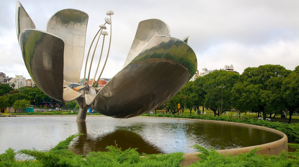 Buenos Aires which includes outdoor art, a pond and a garden