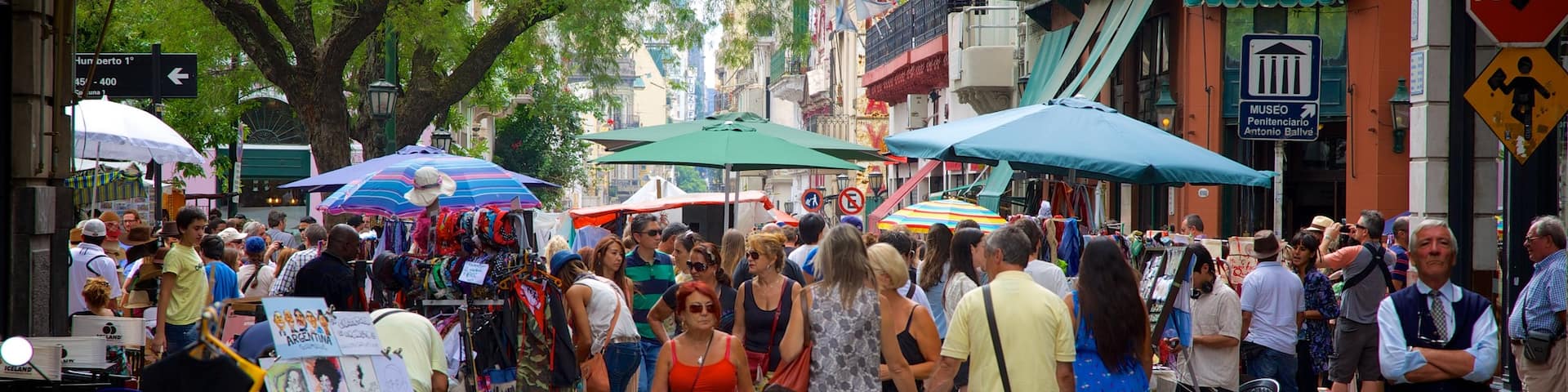 San Telmo which includes street scenes and markets as well as a large group of people