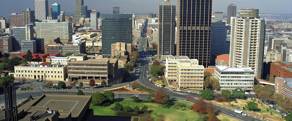 Johannesburg - Gauteng featuring a high-rise building and a city