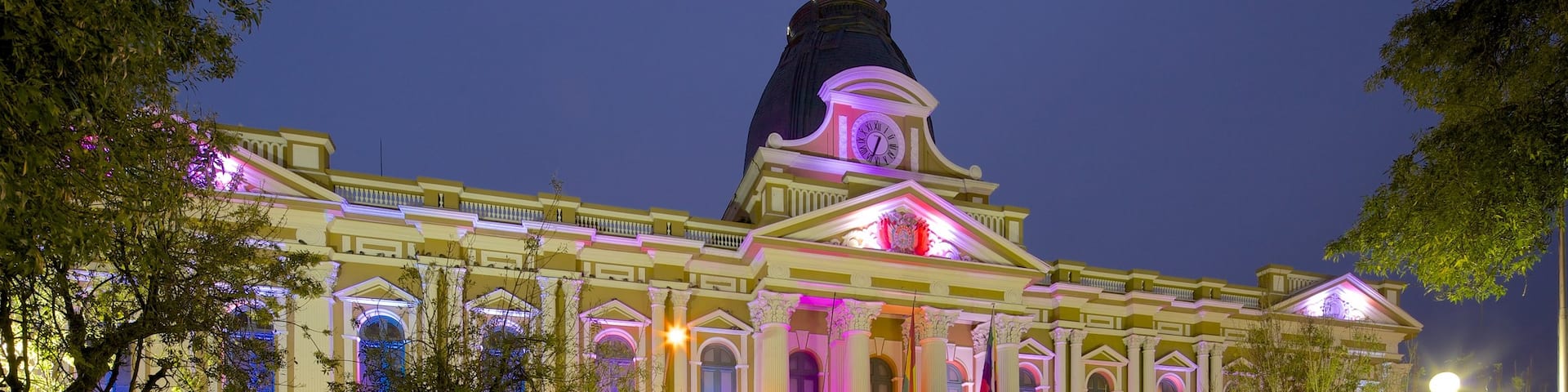 Plaza Murillo featuring a city, night scenes and heritage architecture