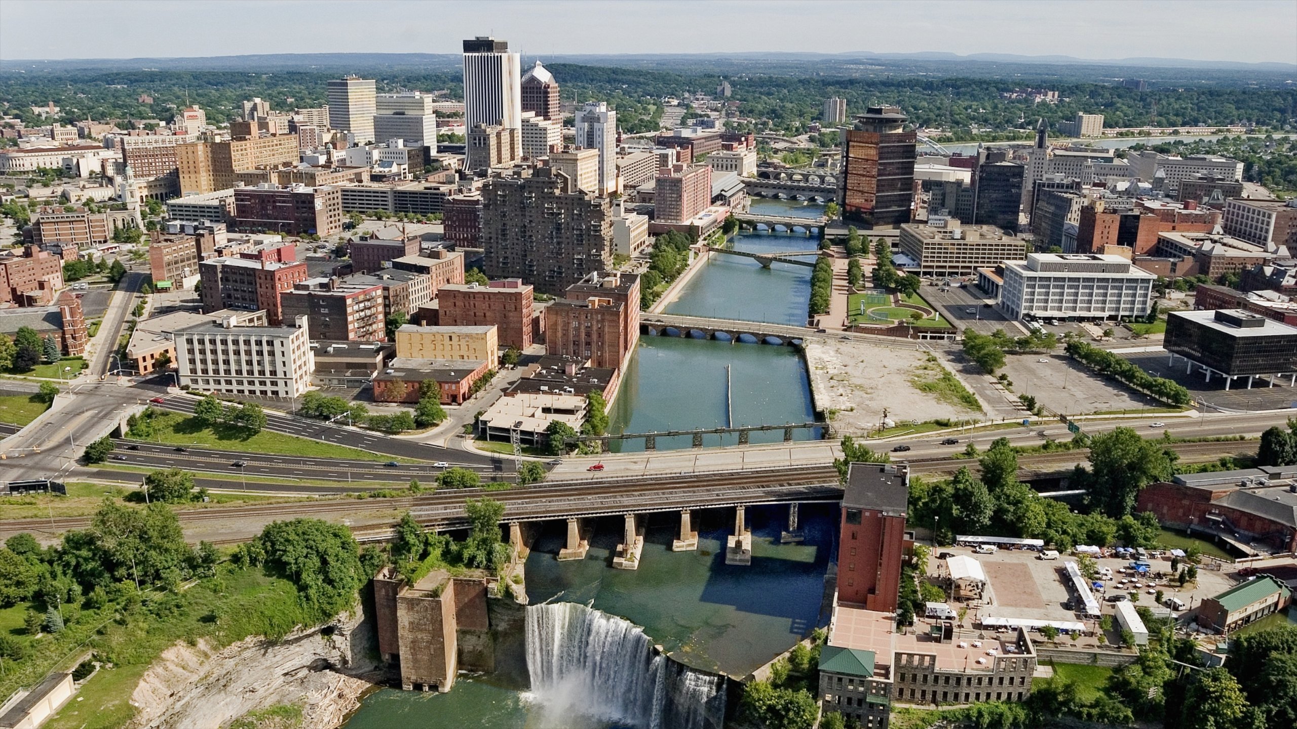 Rochester showing a city, a bridge and a river or creek