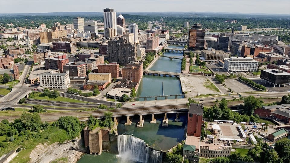 Rochester showing a city, a bridge and a river or creek