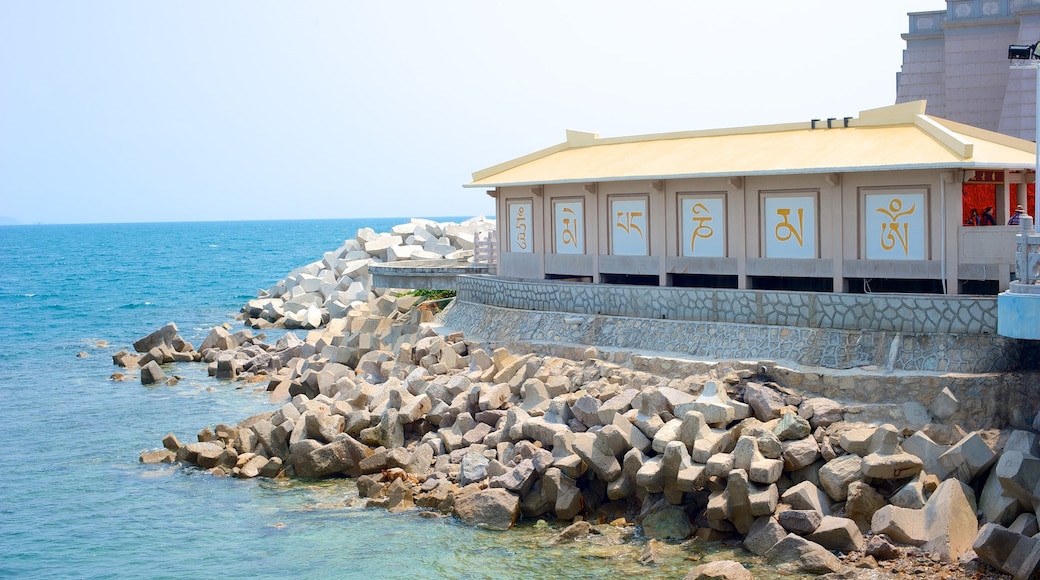 Guanyin Statue of Hainan showing rocky coastline