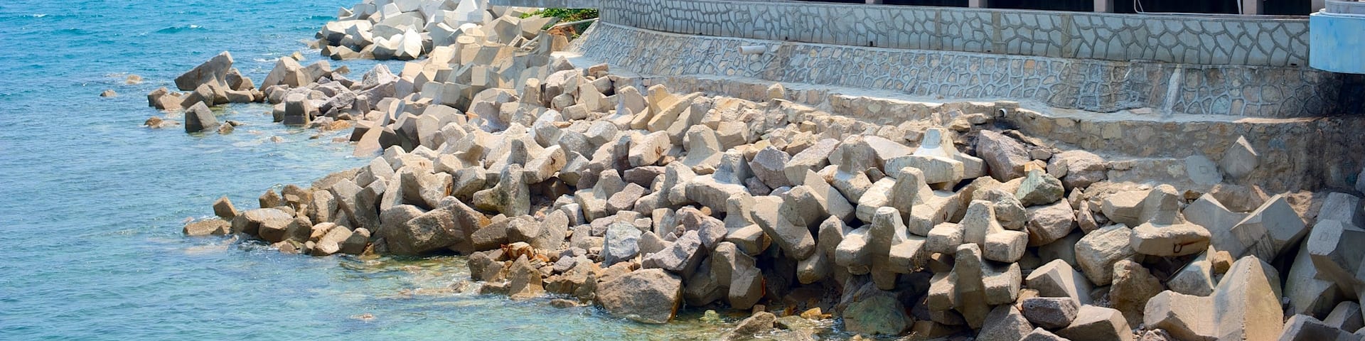 Guanyin Statue of Hainan which includes rugged coastline