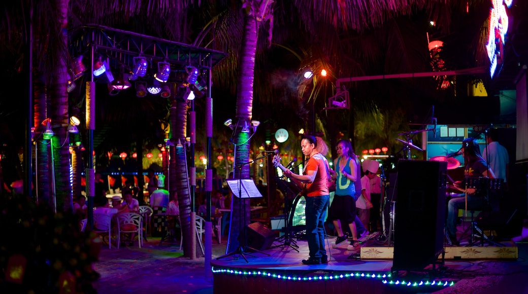 Dadongdai Beach featuring night scenes, performance art and music