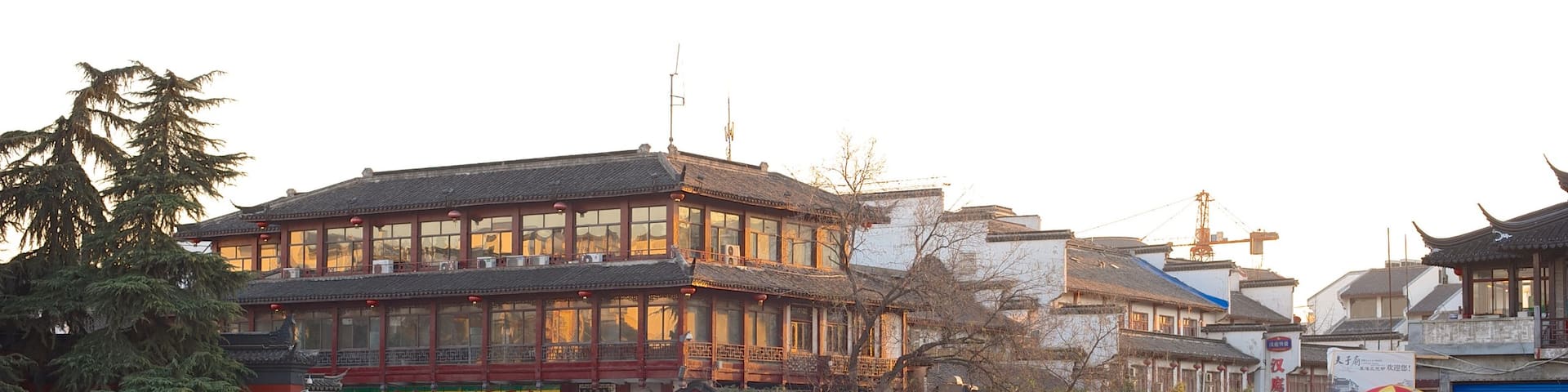 Temple of Confucius showing a temple or place of worship, a city and a sunset