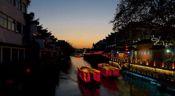 Nanjing featuring night scenes, a river or creek and a sunset