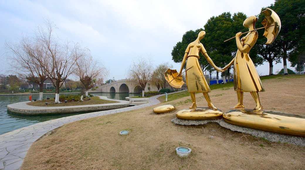 Jinji Lake showing outdoor art, a park and a statue or sculpture