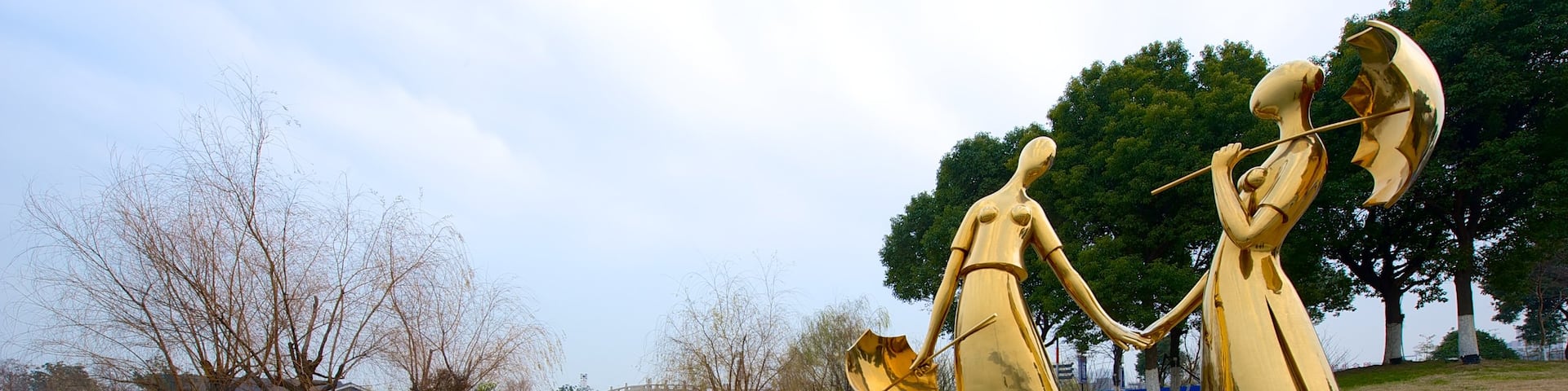 Jinji Lake which includes outdoor art, a lake or waterhole and a statue or sculpture